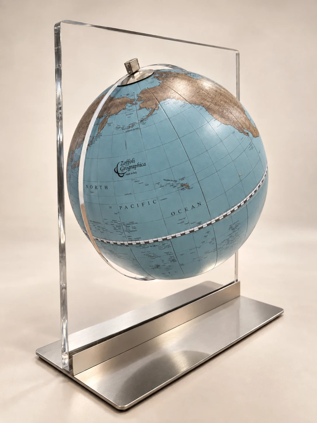Zoffoli Aria: Avio globe suspended in a clear rectangular frame on a metal base.