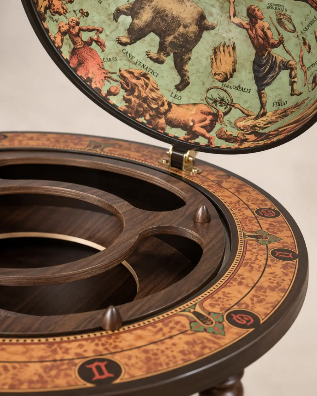 Zoffoli Bacco: close-up of the Lagoon globe bar's illustrated inner lid and wooden bottle compartments.