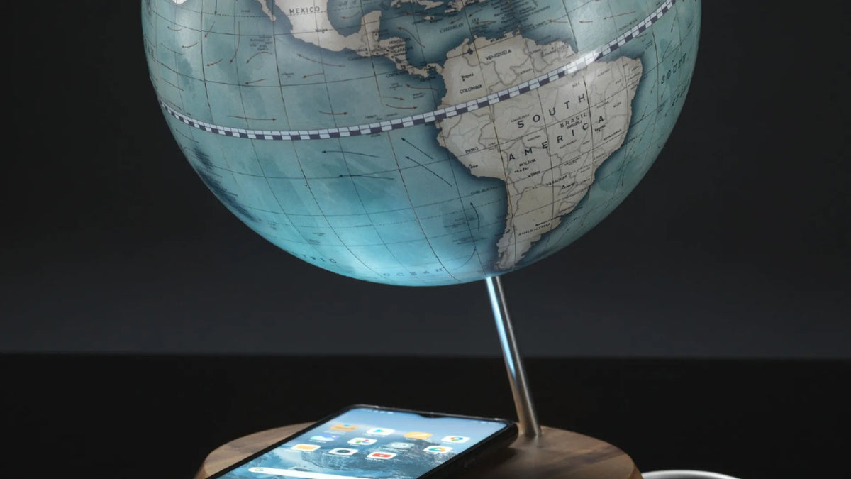 Zoffoli Bridge: close-up of the blue world map and smartphone on the wooden charging base.