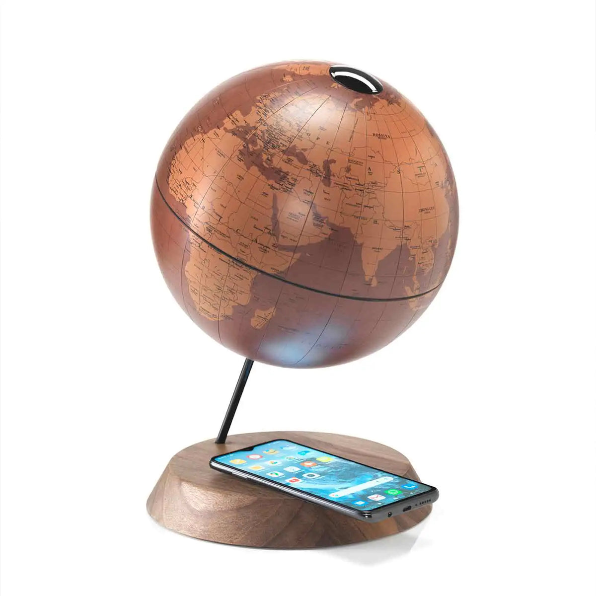 Zoffoli Bridge: Tecnocuoio desk globe with a brown map and smartphone on the wooden charging base.