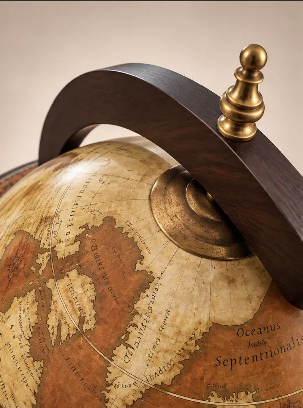 Detail of the Da Vinci Rust globe's brown world map, curved ring and brass-coloured finial.