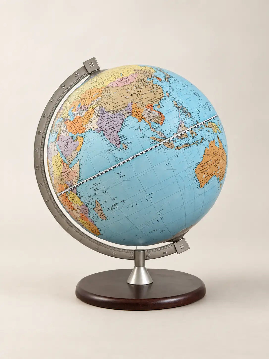 Zoffoli James Cook educational desk globe with a colourful world map, metal ring and dark base.
