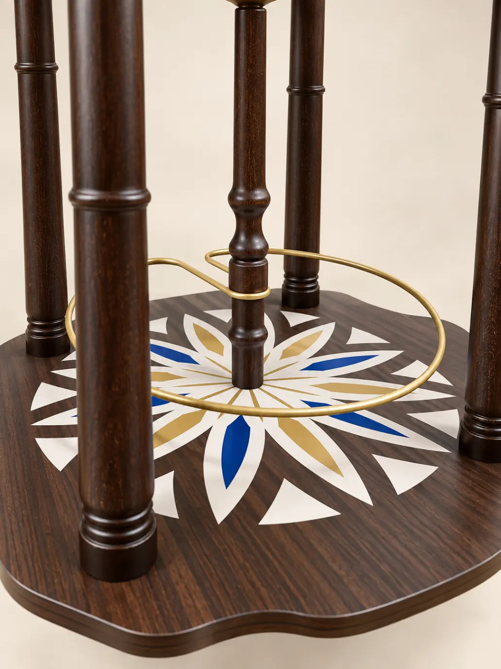 Zoffoli Lapis: close-up of the turned wooden legs and decorated compass rose lower shelf.