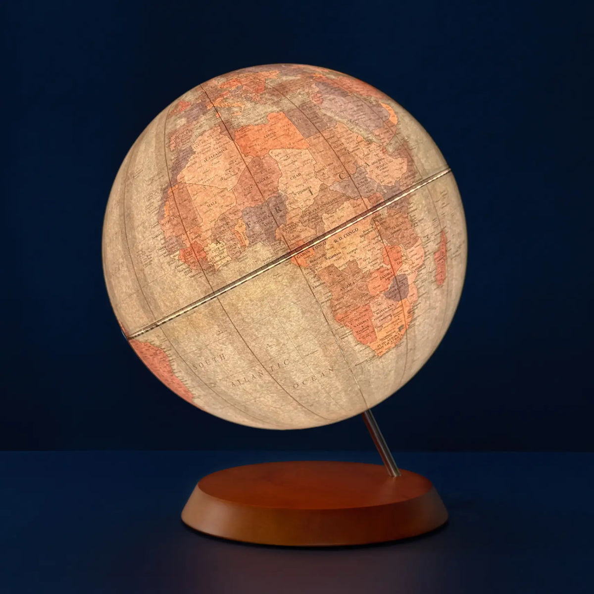 Zoffoli LUME: illuminated world globe with a softly glowing map and wooden base.