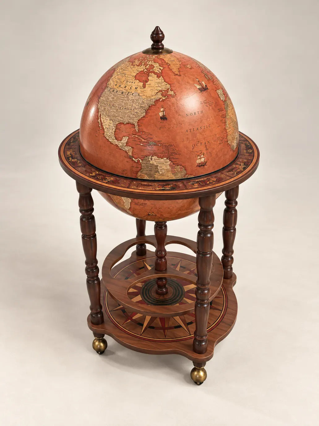 Zoffoli Petra: Cognac globe bar showing the closed brown sphere and decorated lower shelf.