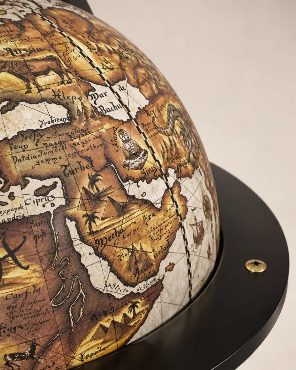 Zoffoli Vulcano: detail of the world map and dark circular wooden ring.