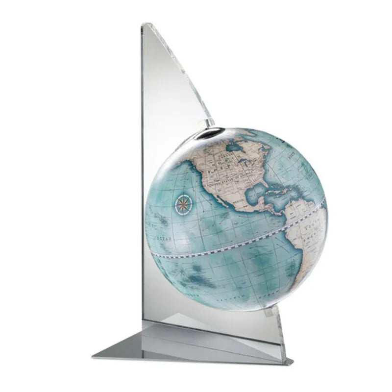 Zoffoli Vela: Indigo tabletop globe with a blue world map and transparent sail-shaped support.