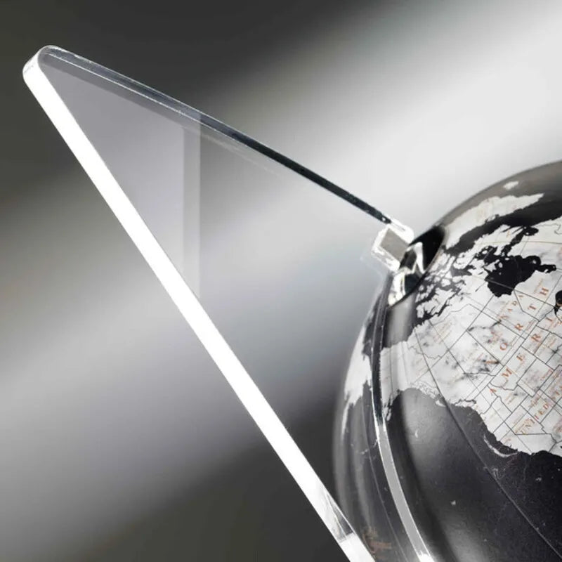 Zoffoli Vela: close-up of the black world map and transparent sail-shaped support.
