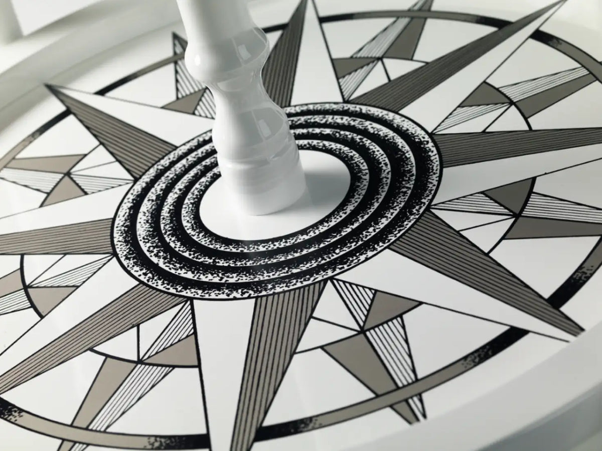 Zoffoli Elegance: close-up of the compass rose decoration on the globe bar's lower shelf.